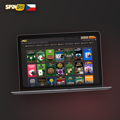 Hráč u stolního PC s lobby Spinboss Kasino – desktopový klient na velké obrazovce